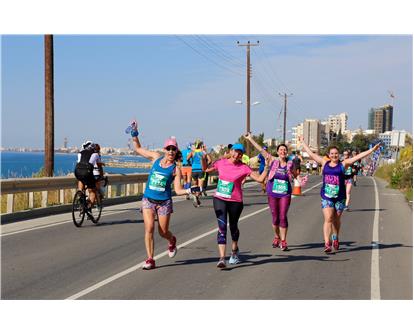 happy runners on coast Limassol 